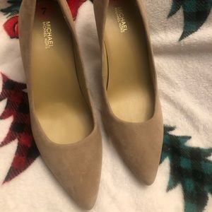 Tan, Michael Kors pumps. They are beautiful, never worn but no tags.